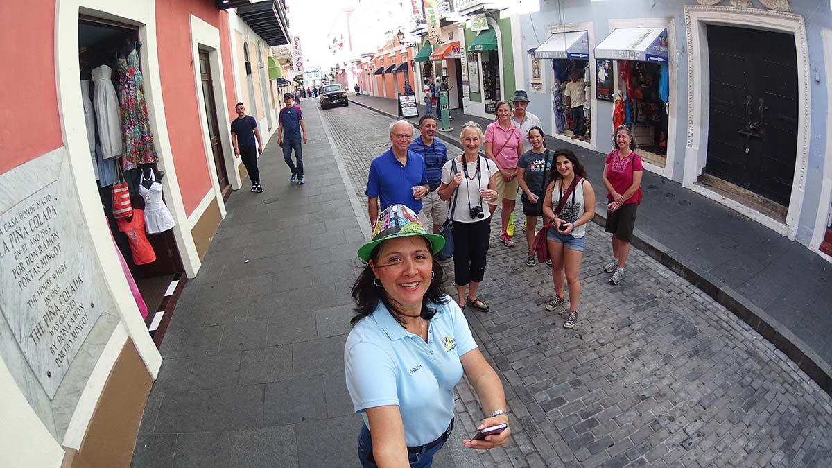 Tour Guide Debbie explaining Puerto Rico history to visitors