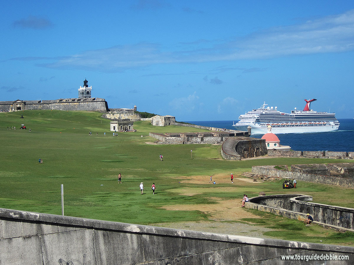 Carnival cruise ship sailing near San Felipe del Morro